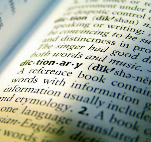 Picture of the word dictionary from its definition in a dictionary where we see the page